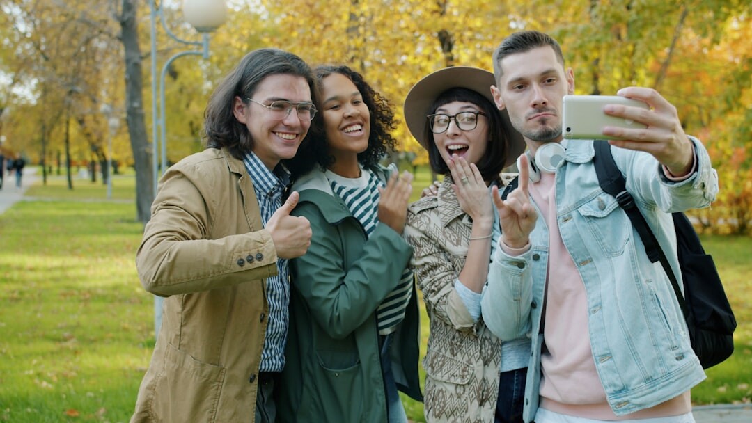 group of friends filming outdoors