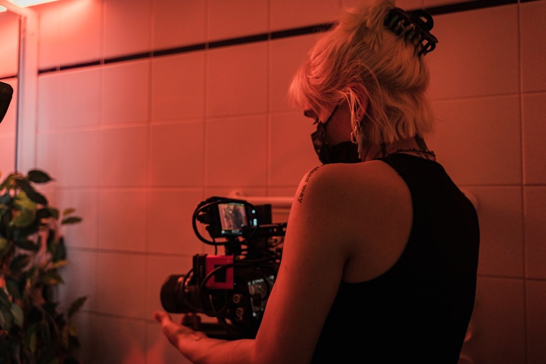cinematographer adjusting camera